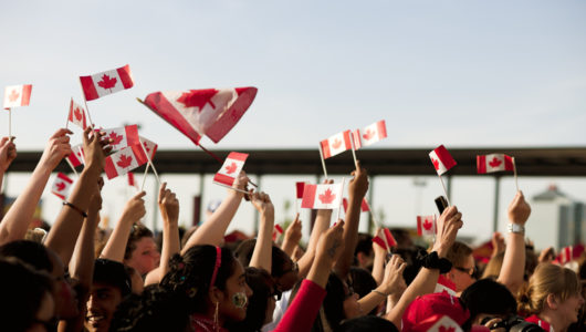 people-waving-canadian-flags